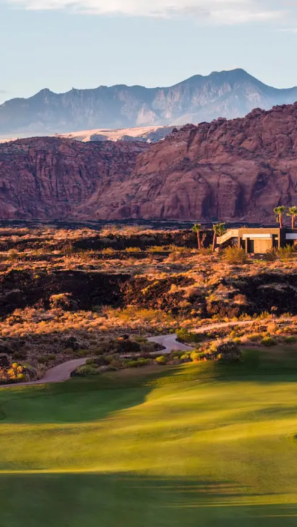 Golfer on a course at sunset