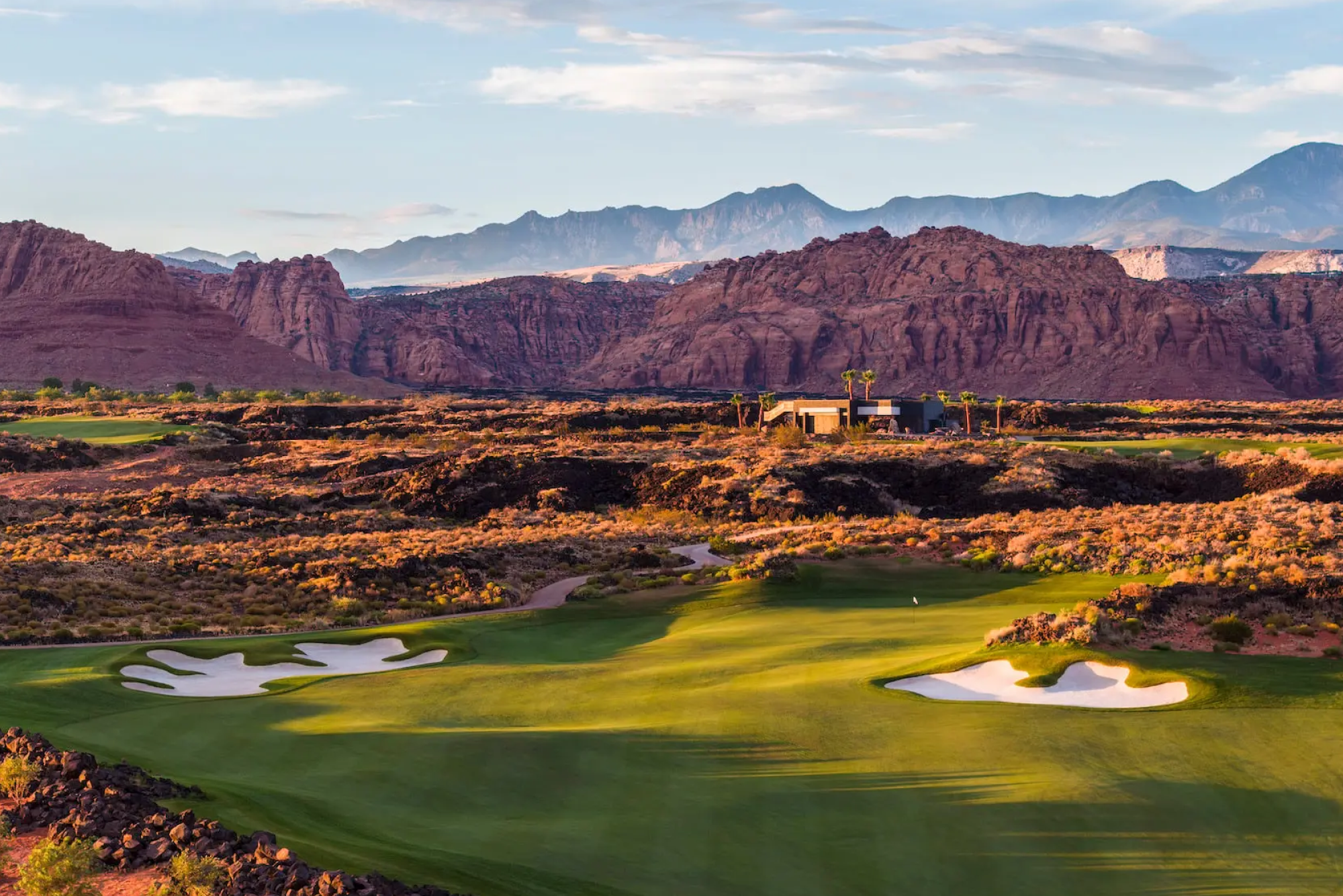 Golfer on a course at sunset